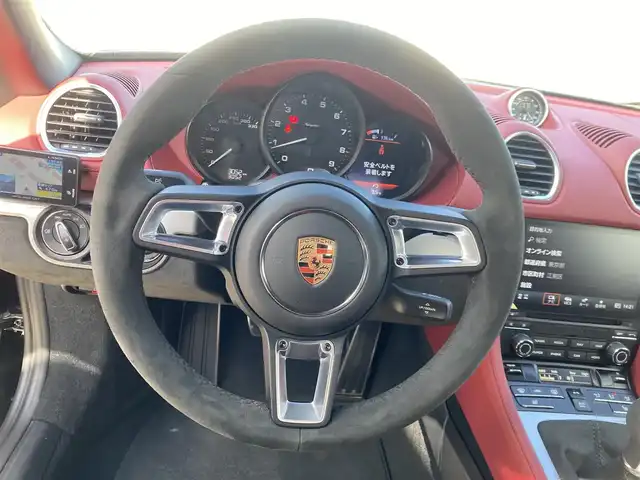 ポルシェ ポルシェ ７１８スパイダー 東京都 2023(令5)年 0.3万km ブラック 左ハンドル/ワンオーナー/ソフトトップ：レッド/OP/レザーインテリア/OP/PDLS+付きLEDヘッドライト/OP/ゴールド20インチAW/OP/電動可倒式ドアミラー/OP/シートヒーター/スポーツクロノパッケージ/スポーツエグゾースト/純正ナビゲーション(bluetooth/CarPlay)/バックカメラ/フロアマット/GPSレーダー/ドライブレコーダー/ETC/保証書・取説・スペアキー